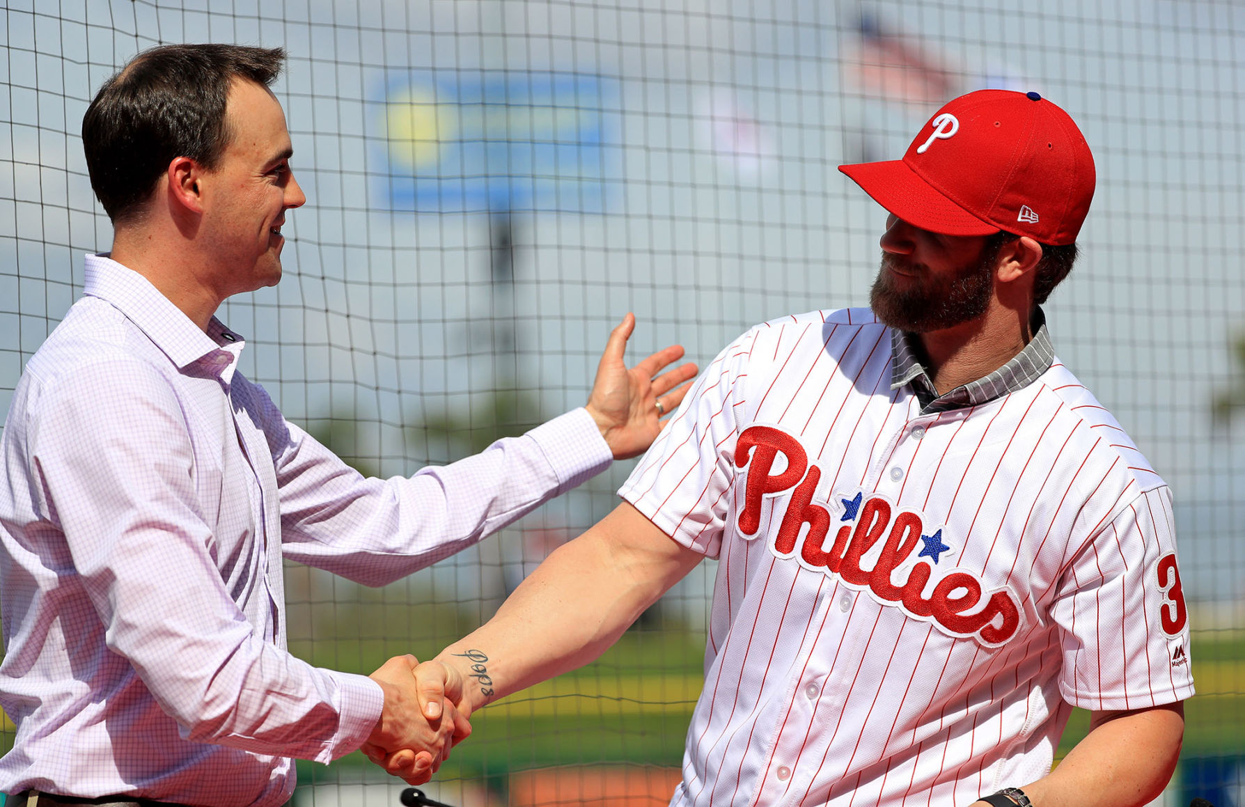 Bryce Harper is introduced to the Philadelphia Phillies by General Manager Matt Klentak during a news conference at Spectrum Stadium in Clearwater, Fla., on March 2, 2019. (Mike Ehrmann/Getty Images) **FOR USE WITH THIS STORY ONLY**